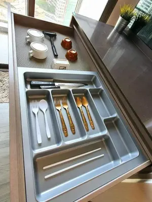 a drawer in a refrigerator with utensils in it at The room, luxury condo 21fl 1 Bedroom ,near bts in Bangkok