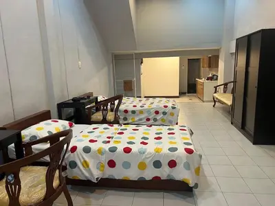 two beds with polka dots on them in a room at Niche Space Sripraya- Samyan in Bangkok