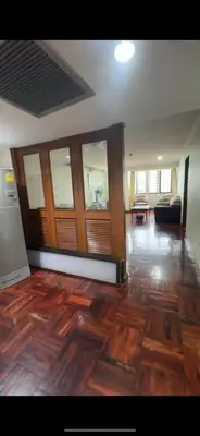 a living room with a wooden floor and a couch at Beautiful 1 bedroom Appartment in the Heart of Bangkok in Bangkok