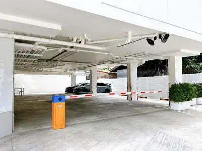 a car garage with a car parked in it at Komfort Duplex BTS Ratchayothin in Bangkok