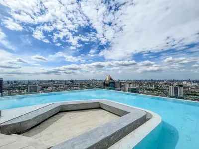 a swimming pool on the roof of a building at Duplex near BTS l Rooftop Pool l Skyline l Sontana in Bangkok