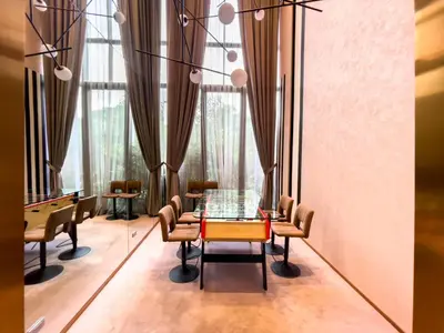 a dining room with a glass table and chairs at Near BTS l Fully Furnished l Pool and Gym l Sontana in Bangkok