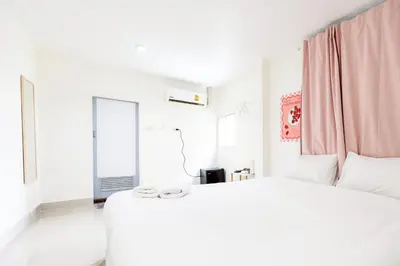a white bedroom with a large bed and a window at XX Oh My Nap - Sukhumvit 3 - โอ้มายแนป สุขุมวิท 3 in Makkasan