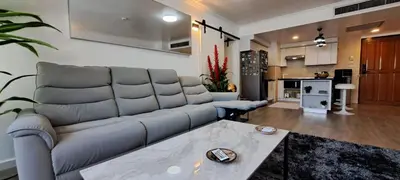 a living room with a couch and a table at Newly renovated 1 bedroom condo NANA in Bang Kapi