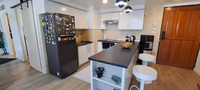a kitchen with a black refrigerator and a counter at Newly renovated 1 bedroom condo NANA in Bang Kapi