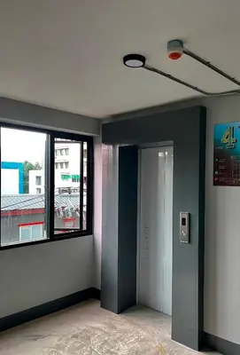 an empty room with a door and a window at Fit mansion in Sathani Sam Sen
