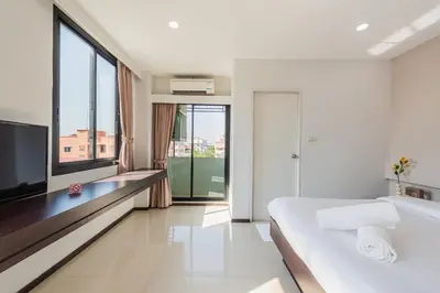 a hotel room with a bed and a large window at ZAYN Bangna Hotel in Bangna