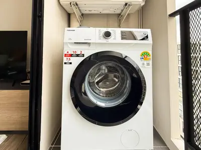 a white washing machine in a room at Near BTS - Near Iconsiam - Pool and Gym - Sontana in Bangkok