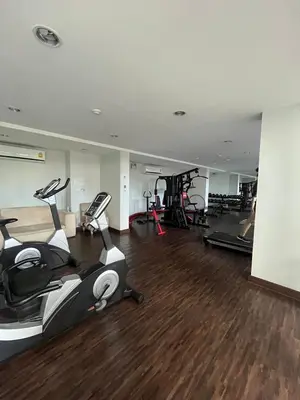 a gym with treadmills and exercise bikes in a room at AC Home 1 Laksi in Lak Si