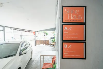 a white car parked in front of a restaurant at Dec room at bangsue in Bang Su