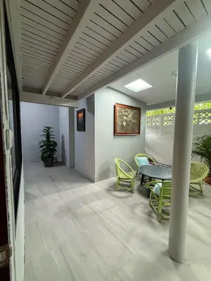 a room with a table and chairs and a table at Pridi cozy home with good location Type A in Bangkok
