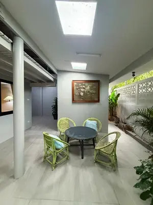 a meeting room with a table and chairs at Pridi cozy home with good location Type A in Bangkok