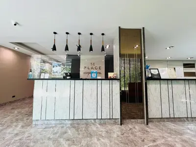 a restaurant with a counter in a room at 14 Place in Bangkok