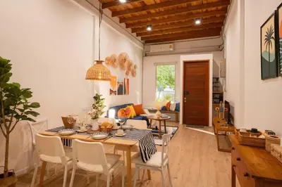 a dining room with a table and chairs at Soulful Stay-Hidden Thai-Mediterranean Retreat. in Bangkok
