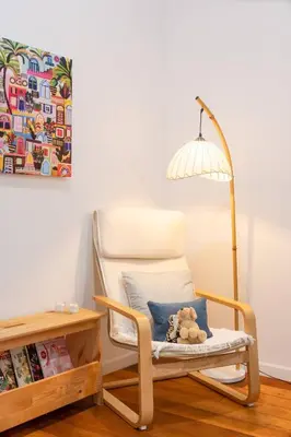 a rocking chair with a teddy bear sitting on it at Soulful Stay-Hidden Thai-Mediterranean Retreat. in Bangkok