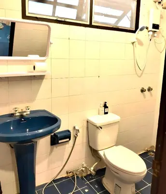 a bathroom with a toilet and a sink at XX Mitr Inn Sukhumvit 2 - มิตร อินน์ สุขุมวิท 2 in Bang Kapi