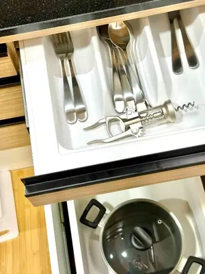 a stove top oven with utensils in it at Spacious 2BR2BA in Thonglor with WiFi & balcony in Khlong Toei