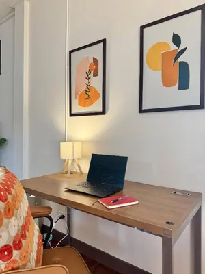 a desk with a laptop sitting on top of it at Spacious 2BD 2BA Apartment in Thong Lor in Khlong Toei