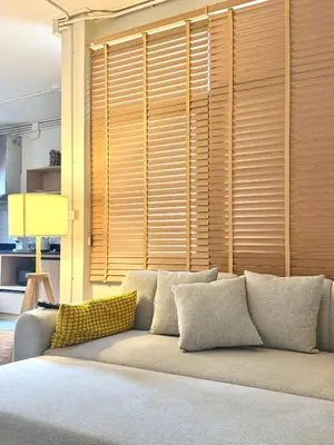 a couch in a living room with a large window at Spacious 2BD 2BA Apartment in Thong Lor in Khlong Toei