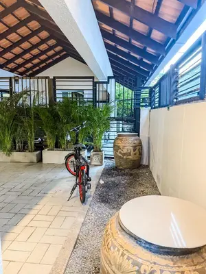 a bike parked in a room with plants at Pridi cozy home with good location Type C in Bangkok