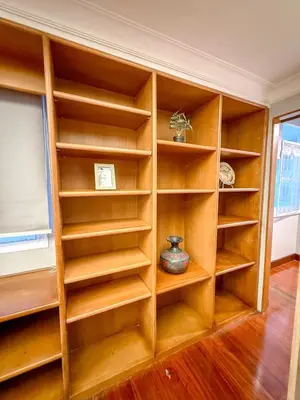 a built in book shelf in a room at Pridi cozy home with good location Type C in Bangkok