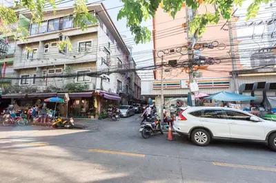 a city street with a white car parked on the street at Siam Central 2BR Yumi house Near IconSiam in Bangkok