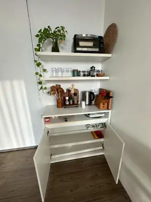 a white kitchen with white shelves and a drawer at Free Wi-Fi Private Room I Near the Mall Bangkapi in Bangkok