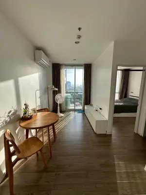 a living room with a table and a bedroom at Free Wi-Fi Private Room I Near the Mall Bangkapi in Bangkok