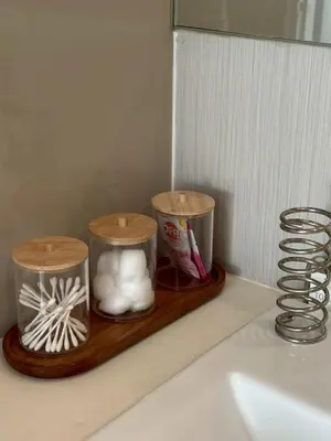 a shelf with two candles on top of a sink at Free Wi-Fi Private Room I Near the Mall Bangkapi in Bangkok