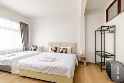 a white bedroom with a large white bed and a window at Cozy 5-story house, 2 mins walk BTS, BKK in Bangkok