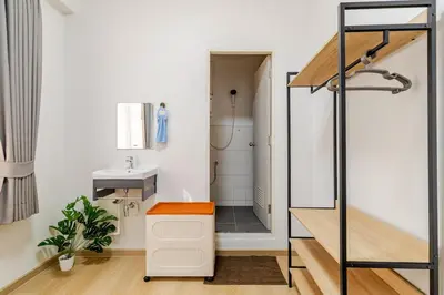 a bathroom with a toilet and a sink and a shower at Cozy 5-story house, 2 mins walk BTS, BKK in Bangkok