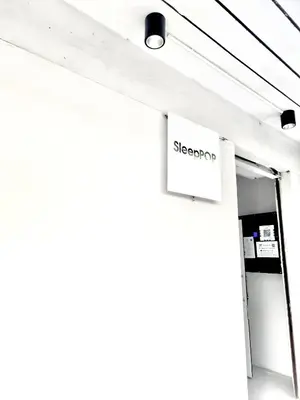 a sign for a sleep shop on the side of a building at XX SleepPOP Sukhumvit 42 - BTS Ekkamai Station - Bangkok in Phra Khanong