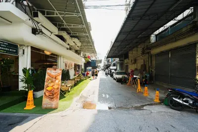 an empty street in a building with people walking down it at XX SleepPOP Sukhumvit 42 - BTS Ekkamai Station - Bangkok in Phra Khanong