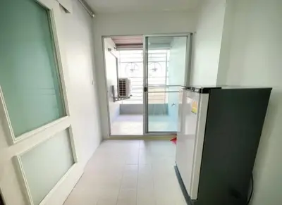 a kitchen with a refrigerator and an open door at อุดมสุข BTS udomsuk in Bangna