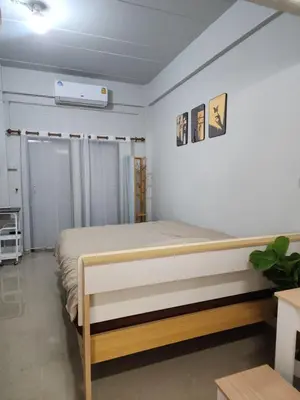 a bedroom with a bed in a room at Sabai room in Taling Chan