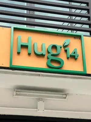 a sign for a huaxi restaurant at Hug14 Hotel in Ban Bang Toei (1)