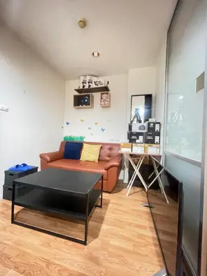 a living room with a couch and a table at Lumpini nawamin in Ban Bang Toei (1)