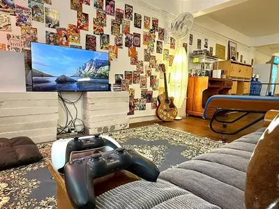 a living room with a couch and a tv at Super BIG Mid Century Home near River & IconSiam in Khlong San