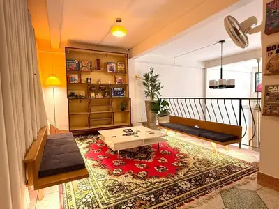a living room with a coffee table on a rug at Super BIG Mid Century Home near River & IconSiam in Khlong San