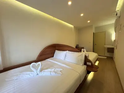 a hotel room with a bed with a heart on it at Sonata siam-ratchathewi in Bangkok