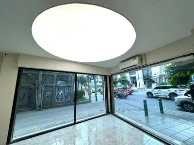 a building with a large light hanging from the ceiling at Sonata siam-ratchathewi in Bangkok