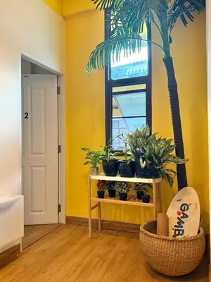 a room with a table with plants and a window at Office 3 in Bangkok