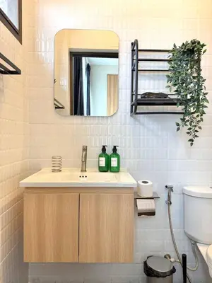 a bathroom with a sink and a mirror at Office 3 in Bangkok