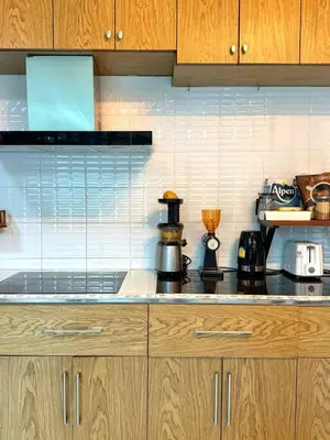 a kitchen counter with a coffee maker on it at Office 3 in Bangkok