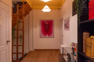 a hallway with a large red object on the wall at office 2 in Bangkok