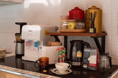 a kitchen counter with a coffee maker on a counter top at office 2 in Bangkok