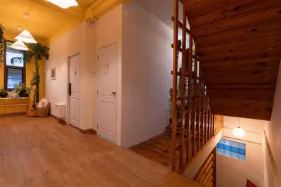 a hallway with a wooden staircase in a house at office 2 in Bangkok