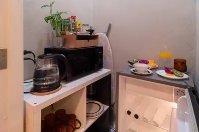 a kitchen with a microwave on top of a counter at office 2 in Bangkok