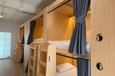 a small room with bunk beds in it at Nana Best Hostel in Makkasan