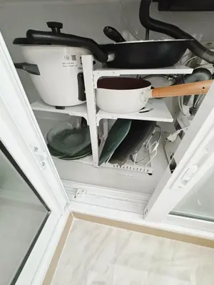 a kitchen drawer filled with dishes and utensils at Silom Hideaway 27 Floor City View, 4-min to BTS in Bangkok